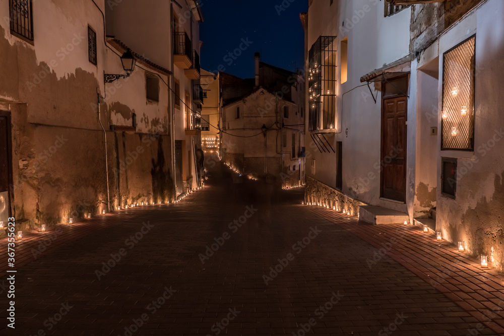 Titaguas village, streets illuminated by candles drawing shapes on the night of the candles celebration local july festival at Valencia Spain