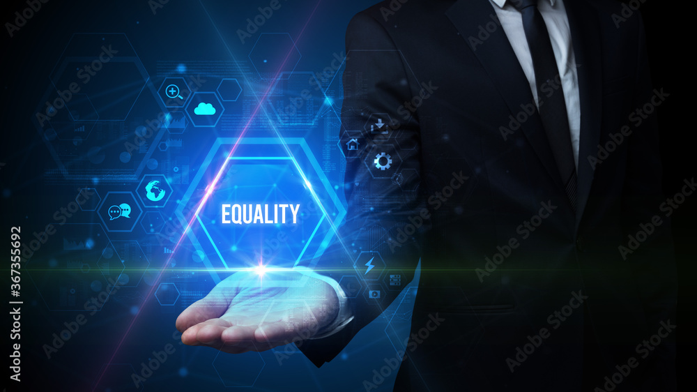Man hand holding EQUALITY inscription, social media concept Man hand holding EQUALITY inscription, social media concept