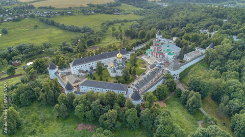 Savvino-Storozhevsky Monastery (Storozhi monastery of St. Savva) is  Russian Orthodox monastery dedicated to feast of Nativity of Theotokos. Aerial view. Summer day. Landscape of Moscow suburb photo