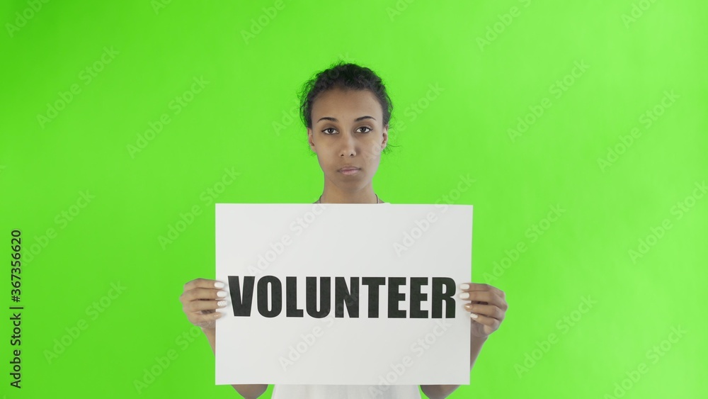 Afro-American Girl Activist With Volunteer Poster on chroma key background Afro-American Girl Activist With Volunteer Poster on chroma key background
