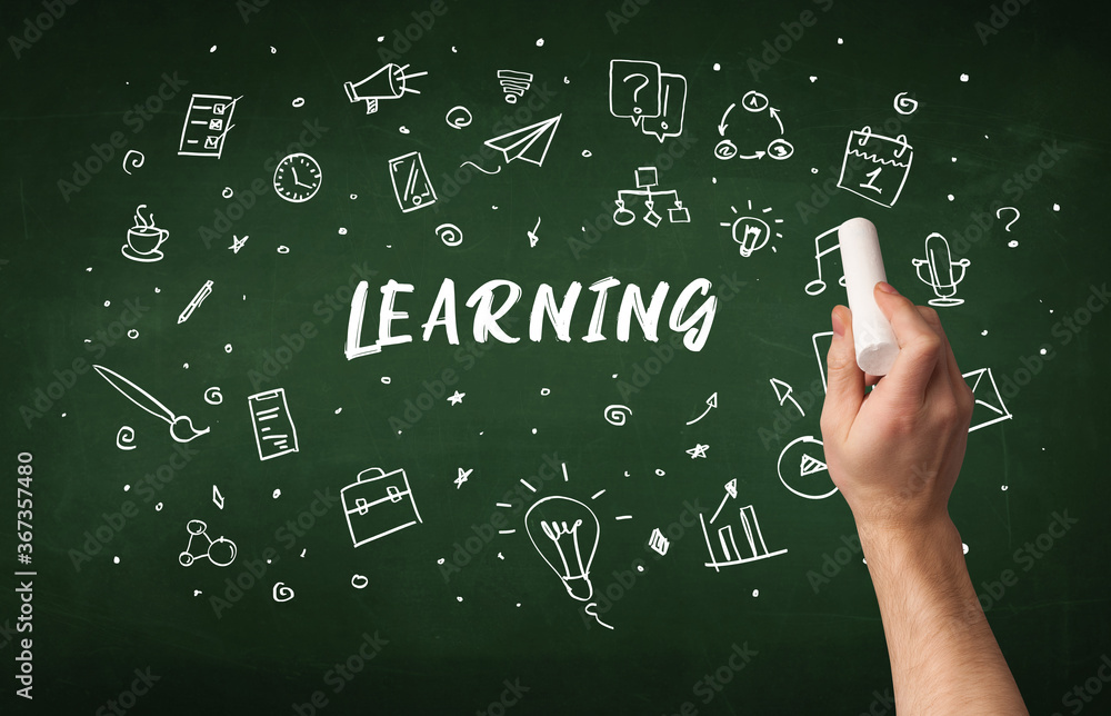 Hand drawing LEARNING inscription with white chalk on blackboard, education concept Hand drawing LEARNING inscription with white chalk on blackboard, education concept
