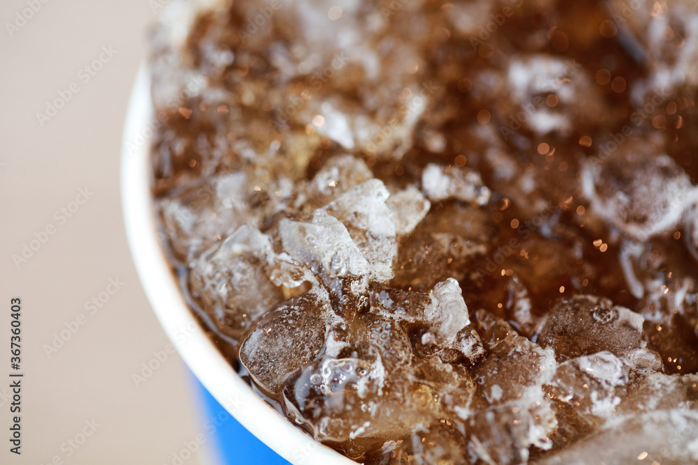 Food and Beverage, close up cola in ice cube with bubble