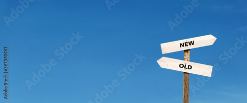 the way forward from the old to the new. word on signposts with copy space on the panoramic sky background. business opportunity and change improvement concept.
