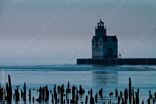 The Kewaunee Pierhead Lighthouse With Broken Supports of Rotten Pier, Kewaunee, Wisconsin, USA photo