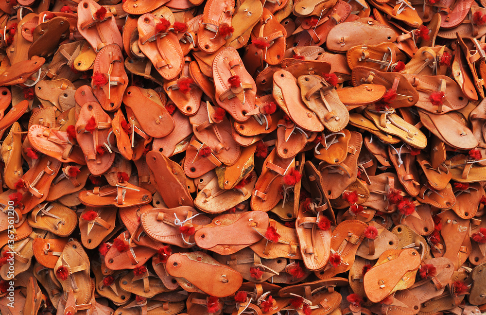 background of famous Kolhapuri chappals. shot at Kolhapur in Maharashtra by road side stall on 3 july 2015 background of famous Kolhapuri chappals. shot at Kolhapur in Maharashtra by road side stall on 3 july 2015