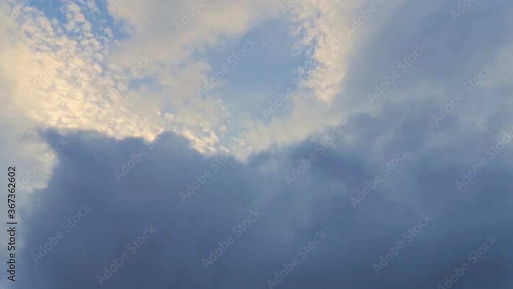 sky with evening sun being covered quickly by grey clouds. Changing weather sky with evening sun being covered quickly by grey clouds. Changing weather