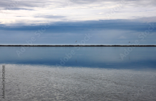 Pristine water scenes with reflections and brilliant blue skies