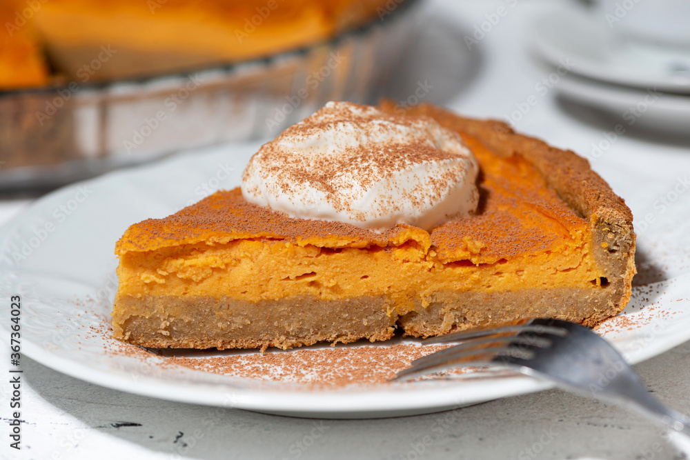 piece of pumpkin pie with cream, closeup piece of pumpkin pie with cream, closeup