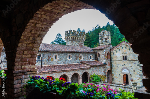 View of Courtyard Walls Through Archway With Flowers at an Italian Style Castle in Napa Valley,Calistoga, California, USA