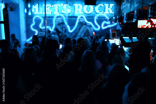 blurred background rock concert, night club, music, crowd of people a lot