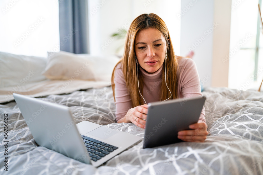 Beautiful young woman using laptop at home Beautiful young woman using laptop at home