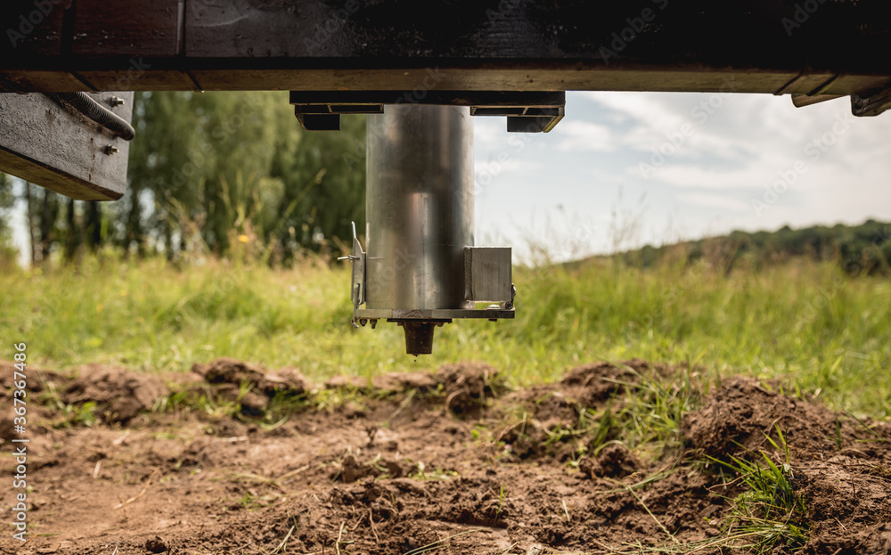 Soil examination. Collecting black soil on the field for examination