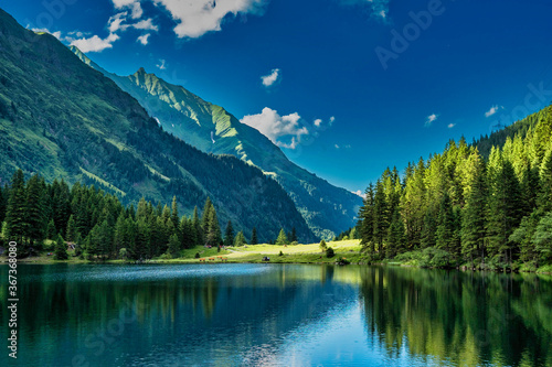 Beautiful lake Hintersee and green mountains and forest in austria in the summer. © Boerlinboi