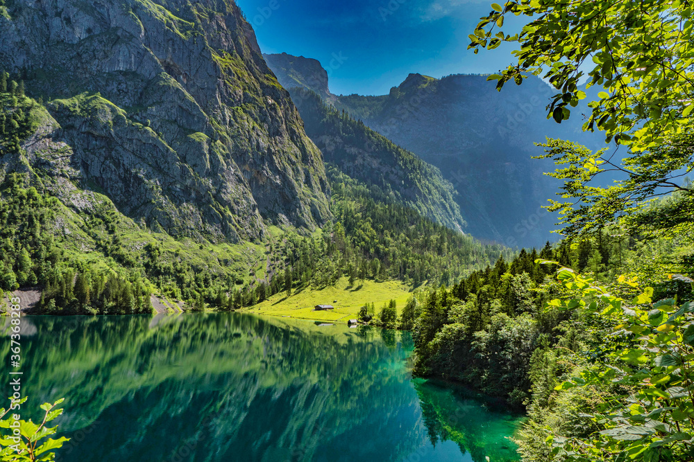Beautiful valley with lake Obersee and green mountains in bavaria, germany in the summer.