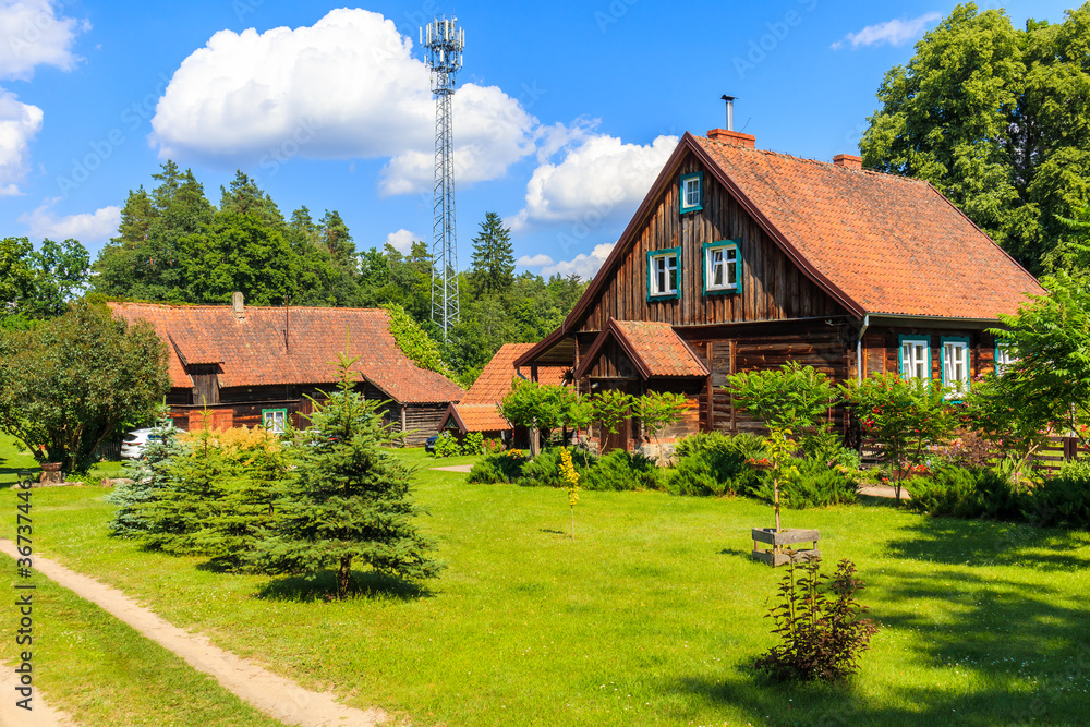 Obraz premium Old traditional rural houses in Krutyn village near lake Mokre, Masurian Lakes, Poland