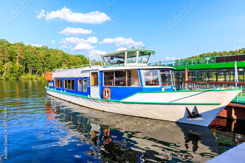 Tourist ship mooring in small port in Ruciane Nida, Masurian Lakes, Poland