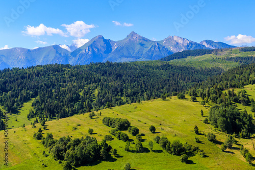 Panorama of Tatra Mountains on beautiful summer sunny day, Lapszanka Pass to Osturnia route, Poland