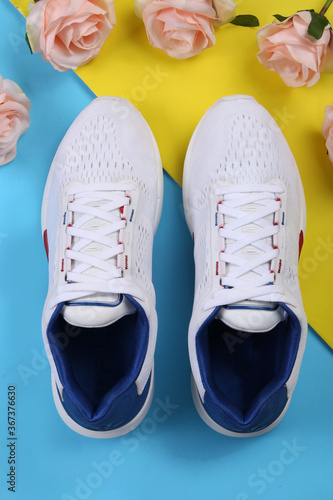 Sports shoes on a colorful background. View from above. Place for text. Flat lay