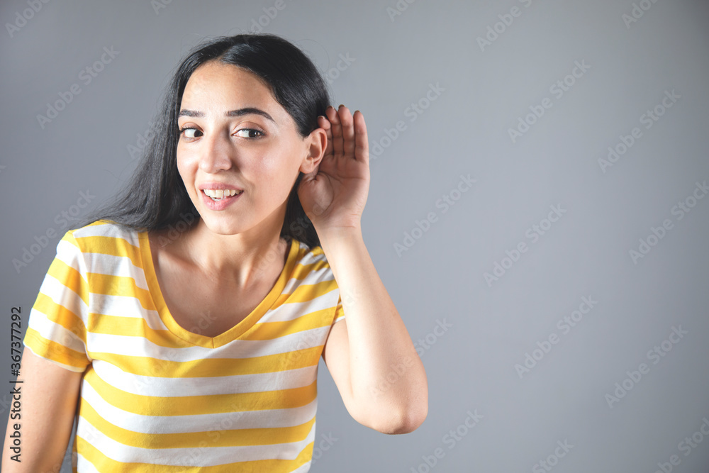 woman hand in ear woman hand in ear