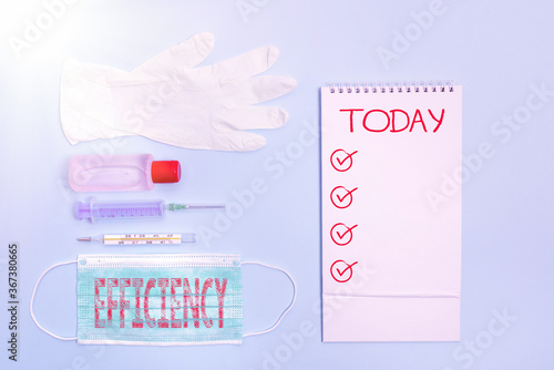 Word writing text Efficiency. Business photo showcasing ability to avoid wasting materials, efforts, in doing something Set of medical equipment with notepad for health condition assessment photo