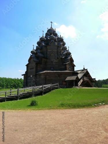 Saint-Petersburg,Russia-07.18.2020: The wooden intercession Church in the Bogoslovka Estate park ensemble in Saint-Petersburg.The church of the holy virgin photo