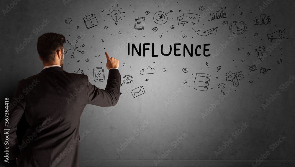 businessman drawing a creative idea sketch with INFLUENCE inscription, business strategy concept businessman drawing a creative idea sketch with INFLUENCE inscription, business strategy concept