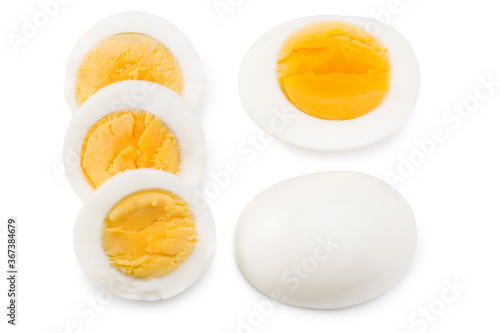Single whole boiled egg with halved egg isolated on a white background. Top view photo