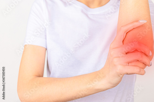 Wallpaper Mural Woman suffering from chronic joint rheumatism. Elbow pain and treatment concept Torontodigital.ca