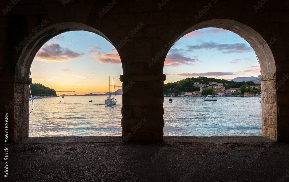 Sea view through two arches of the gallery. Cavtat, Dubrovnik, Croatia.