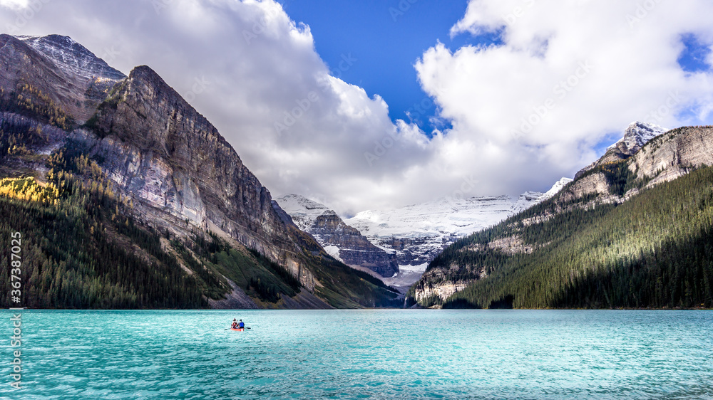 Canoeing on the turquoise waters of Lake Louise in the Rocky Mountains in Banff National Park, Alberta, Canada