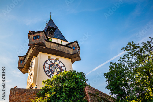 The clock tower, Uhrturm in Graz City. Famous historic structure on summer day