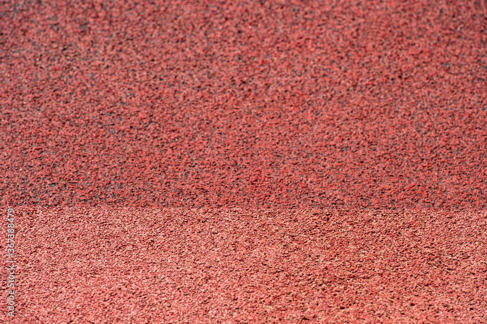 Fototapeta premium Running track rubber cover texture for background. Sport background concept.