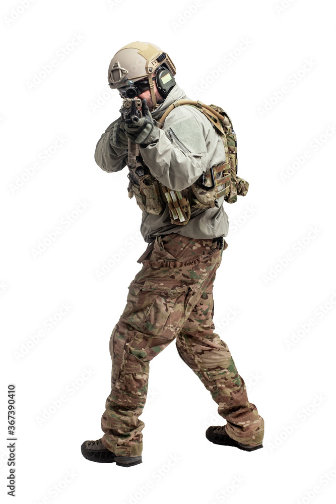 American soldier in military equipment with a rifle attacks on a white background, a commando with weapons in uniform, a ranger in action American soldier in military equipment with a rifle attacks on a white background, a commando with weapons in uniform, a ranger in action