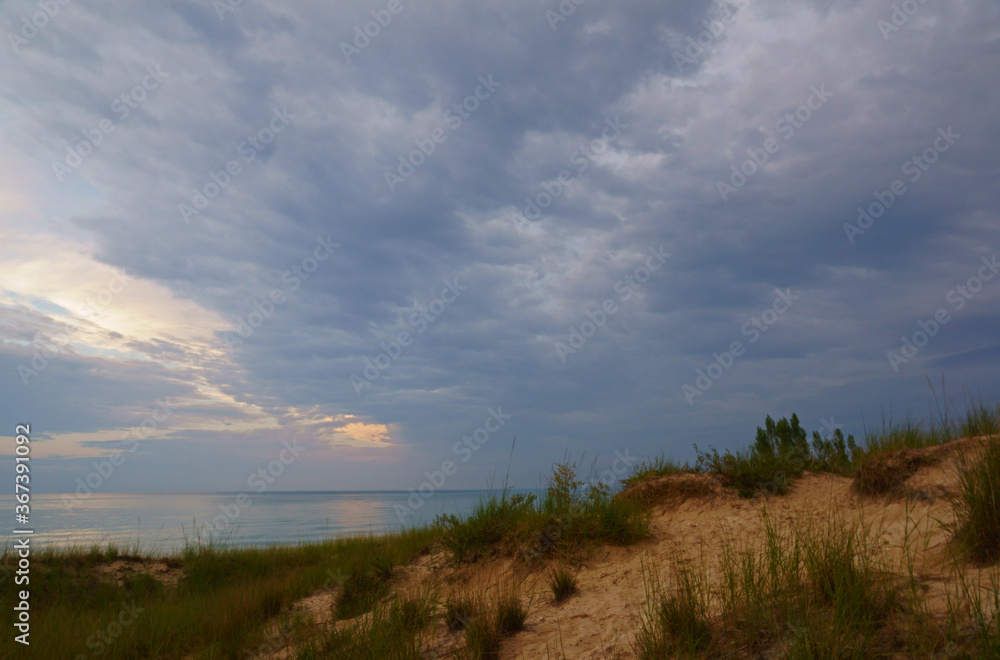 clouds over sand dune