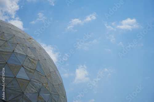 The old observatory on the mountain against the background of blue sky and beautiful clouds.