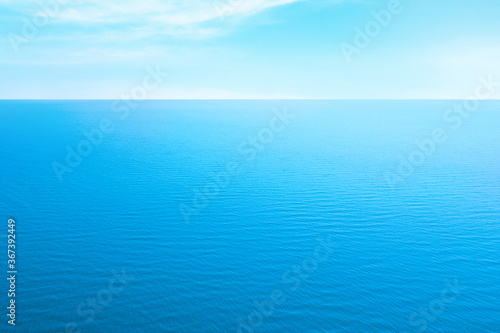 Beautiful ripply sea under blue sky with clouds