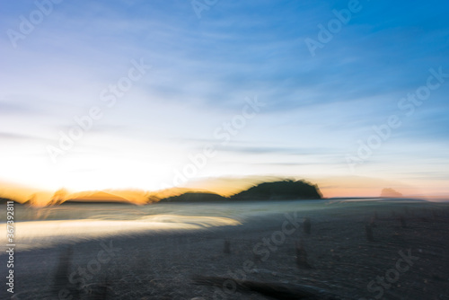 Fototapeta Naklejka Na Ścianę i Meble -  Defocused blue dawn at Puponga Beach, New Zealand