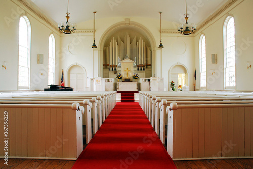 A red carpet leads down the center aisle in the Congregational Church Fairfield, Connecticut