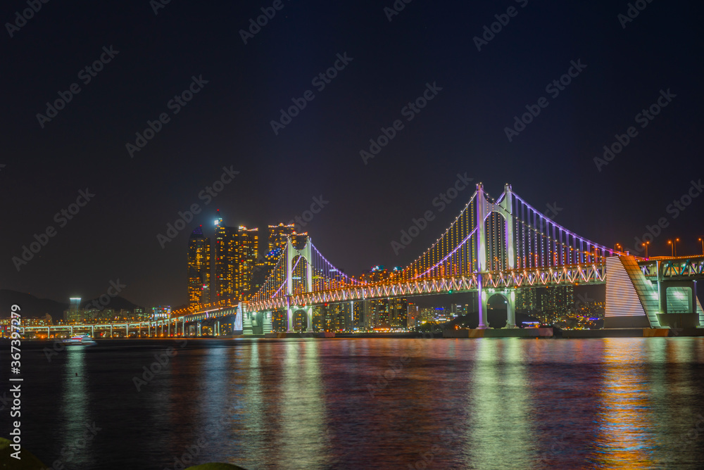 Gwangan Bridge lit up at night in Busan, South Korea.