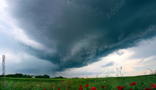 Tornado atmospheric whirlwind in a cumulonimbus thundercloud