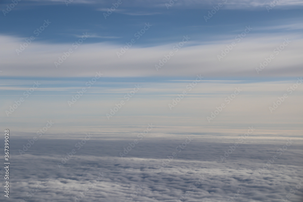 beautiful white clouds on blue sky, view from airplane window beautiful white clouds on blue sky, view from airplane window