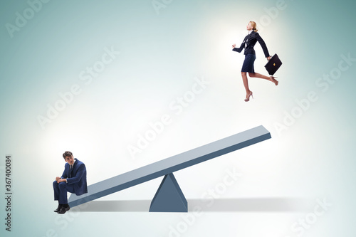 Competition concept with businessman and seesaw photo