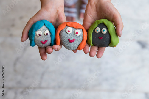 Playing with stones and play dough for children’s activities in preschool or nursery.creative ideas for child development.back to school and happy teachers day concept.