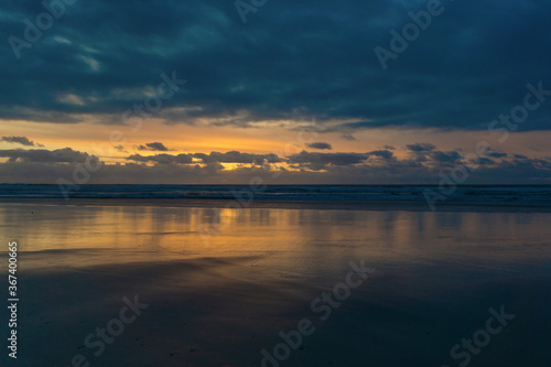 dark storm sky at sunset on the beach © Josefina