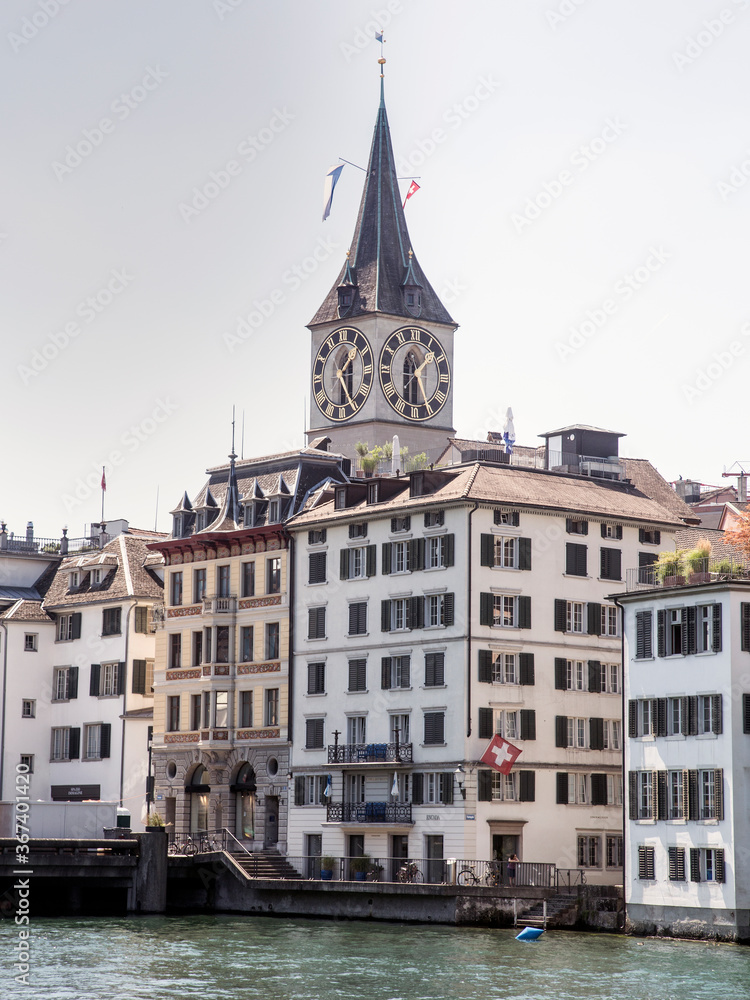 Cityscape of Zurich and river Limmat in daytime with blue sky, Switzerland