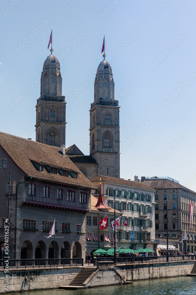 Zurich, Switzerland. View of the historic city center with famous Grossmunster Church, on the Limmat river.