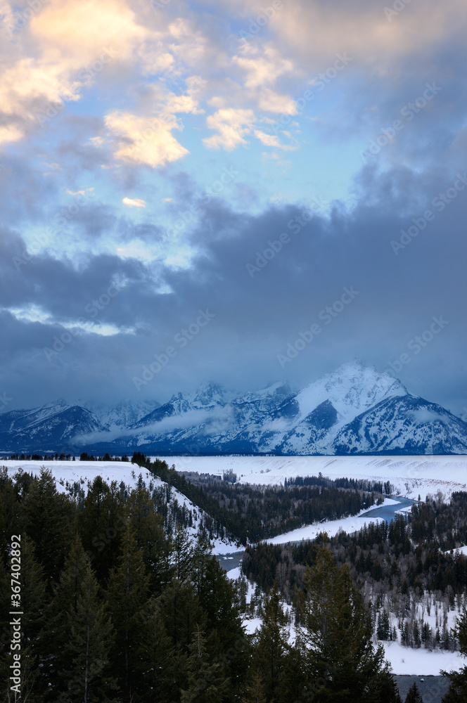 Grand Teton peaks and Snake River at sunset in winter from the Jackson Hole Overlook Wyoming