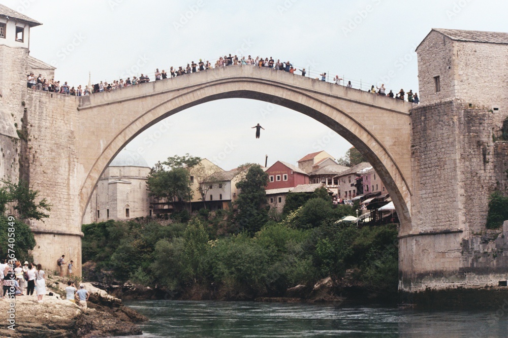 bridge over the river man jumping