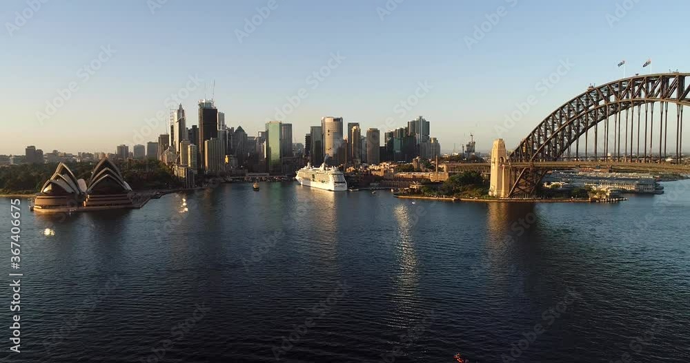 Circular Quay waterfront of Sydney city CBD across harbour in aerial descend.
Circular Quay waterfront of Sydney city CBD across harbour in aerial descend.