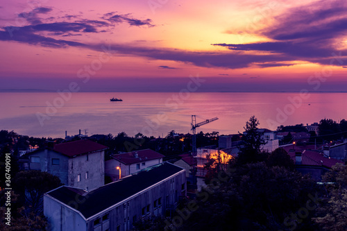 view of the adriatic sea and of the city of Triest at the dusk